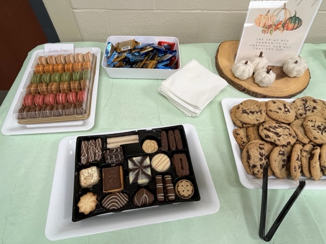 Photo of treat table - chocolate chip cookies, macarons, chocolates.  